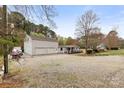 Full house view shows home, with boat storage, driveway and garage at 117 Pine Bluff Dr, Mooresville, NC 28117