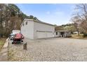 Side view of a spacious 2-car garage and boat storage area offering ample parking and storage at 117 Pine Bluff Dr, Mooresville, NC 28117
