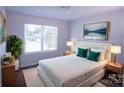 Cozy bedroom featuring neutral tones, a comfortable bed, and a large window with natural light at 1611 Carlton Ave, Kannapolis, NC 28083