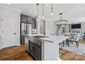 A kitchen with island, stainless steel fridge and an eat-in table at 2133 Moss Bluff Dr, Mint Hill, NC 28227