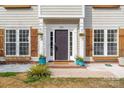 This home features updated trim, flower boxes, and a lovely, covered front porch at 230 Pond View Ln, Fort Mill, SC 29715