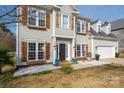 Inviting home exterior featuring detailed trim, beautiful shrubbery, and a well maintained lawn at 230 Pond View Ln, Fort Mill, SC 29715