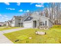 Attractive single-Gathering home showcasing a well-maintained lawn and a paved driveway at 3222 Maple Ridge Dr, Gastonia, NC 28052
