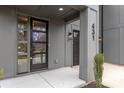 Stylish front door with glass inserts and modern exterior lighting highlighting a warm and inviting entrance at 431 Norris Ave, Charlotte, NC 28206