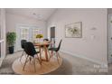 Bright dining room with modern lighting, door to backyard and dining set at 532 Knighton Hill Rd, Rock Hill, SC 29732