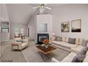 Bright living room featuring a fireplace, ceiling fan, and comfortable seating area at 532 Knighton Hill Rd, Rock Hill, SC 29732
