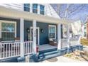Charming front porch showcasing a cozy seating area and decorative touches adding to the home's appeal at 704 N Main Ave, Newton, NC 28658