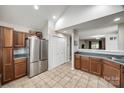 Spacious kitchen with stainless steel refrigerator, tile floors, ample cabinetry, and an open layout at 810 Rock Lake Gln, Fort Mill, SC 29715