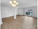 Spacious living room featuring hardwood floors, ample natural light, and a modern design at 9037 Pembroke Ct, Fort Mill, SC 29707
