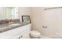 Bathroom featuring granite counters, single sink, toilet and bathtub at 116 Asmodean Ln, Troutman, NC 28166