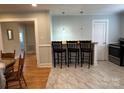 Bright kitchen with sleek marble floors, breakfast bar seating, and stainless steel appliances at 1239 Mitchell Ave, Statesville, NC 28677