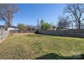 Large backyard with a privacy fence, offering plenty of space for outdoor activities and relaxation at 1305 Price Ave, Kannapolis, NC 28081