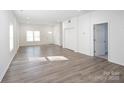 Spacious living room featuring new floors, abundant natural light, and an open layout at 1305 Price Ave, Kannapolis, NC 28081