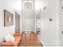 Spacious foyer with hardwood floors, high ceilings, and a decorative sitting bench at 15124 Hugh Mcauley Rd, Huntersville, NC 28078