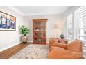 Comfortable sitting area with stylish furniture, decorative rug, and a cabinet for storage and display at 15124 Hugh Mcauley Rd, Huntersville, NC 28078