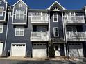 Charming townhouse exterior with attached garages, upper balconies, and modern curb appeal at 1634 Walnut View Dr, Charlotte, NC 28208