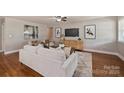 Bright and airy living room with hardwood floors, modern decor, and plenty of natural light at 1837 Academy St, Charlotte, NC 28205