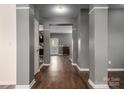 A spacious hallway with hardwood floors and gray walls, offering a view of the home's interior at 2426 Tory Oak Pl, Matthews, NC 28105