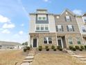 Townhome features brick detail and stairs leading up to a front entrance at 8260 Waxhaw Hwy, Waxhaw, NC 28173