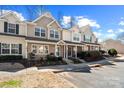 Street view showcasing well-manicured townhomes in a desirable neighborhood at 154 Limerick Rd # D, Mooresville, NC 28115