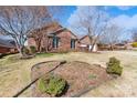 Charming brick home with mature trees and landscaping in front yard at 1963 Wexford Ct, Gastonia, NC 28054