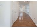 Bright hallway featuring wood floors and white trim at 1963 Wexford Ct, Gastonia, NC 28054