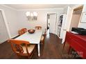 Inviting dining room featuring hardwood floors, table for four, and a charming light fixture at 2010 Simmons St, Gaston, NC 28052