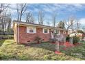 Brick home with manicured front lawn, showcasing a welcoming curb appeal and outdoor space at 213 Turner Rd, Gastonia, NC 28056