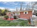 Well-maintained brick home with white trim and landscaping, offering a welcoming curb appeal at 213 Turner Rd, Gastonia, NC 28056