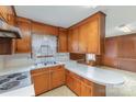 Eat-in kitchen with ample cabinet storage and solid surface counters at 219 Summit St, Norwood, NC 28128