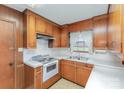 Traditional kitchen with white appliances and tiled backsplash at 219 Summit St, Norwood, NC 28128