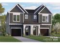 Two-story duplex with vertical siding, a shared front porch, and two single-car garages at 2522 Elkwood Cir, Charlotte, NC 28205