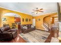 Cozy living room features hardwood floors, a ceiling fan, and opens to a kitchen at 2564 Chasewater Dr, Fort Mill, SC 29707
