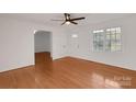 Bright and airy living room with hardwood floors and a large window at 2750 Morgan Rd, Gold Hill, NC 28071