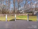 View from the deck showing a spacious fenced backyard, perfect for outdoor activities and relaxation at 3274 Roberta Farms Sw Ct, Concord, NC 28027