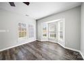 Sun-filled room featuring a bay window, wood-look floors and neutral paint at 4221 Coulter Xing, Charlotte, NC 28213