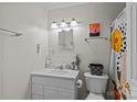 Cozy bathroom featuring a vanity and a shower with colorful curtains at 5140 Old Monroe Rd, Indian Trail, NC 28079