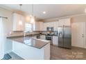 Bright kitchen features granite countertops, stainless steel appliances, and ample cabinet space at 5413 Austin Rd # 4, Monroe, NC 28112