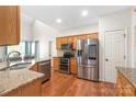 Well-equipped kitchen with stainless steel appliances, granite countertops, and ample cabinet space at 111 Harris Farm Rd, Mooresville, NC 28115