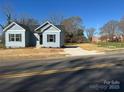 Charming blue house with black shutters on a sunny day at 1501 School Ave, Gastonia, NC 28052