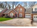 Charming brick home features an attached garage, well-maintained landscaping, and a traditional design at 176 Columns Cir, Shelby, NC 28150