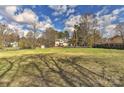 Expansive backyard with lush green grass, ideal for outdoor activities and relaxation at 2013 Barkley Cir, Monroe, NC 28112