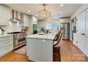 Bright kitchen with a central island, stainless appliances, and granite countertops at 4216 Maureen Dr, Charlotte, NC 28205