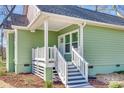 Close up of the bright green home with covered front porch at 7 Private St, York, SC 29745