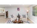 Cozy living room with neutral tones, accent rug, and elegant furnishings at 9105 Touchstone Ln, Charlotte, NC 28227