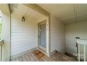 A front door with a glass pane and a pineapple welcome mat at 1001 Churchill Downs Ct # A, Charlotte, NC 28211