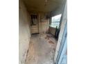 Enclosed porch with lots of natural light from the window and exterior door at 1128 Rosehill Dr, Lincolnton, NC 28092
