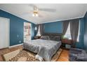 Comfortable primary bedroom featuring soft lighting, and stylish decor at 114 Tr Foster Rd, Kings Mountain, NC 28086