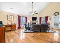Bright living room features a stone fireplace, vaulted ceilings, and hardwood floors at 1263 Waterford Dr, Hickory, NC 28602