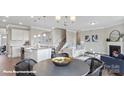 Open-concept living area showcases a modern kitchen, inviting living room, and stylish decor at 132 Asmodean Ln, Troutman, NC 28166